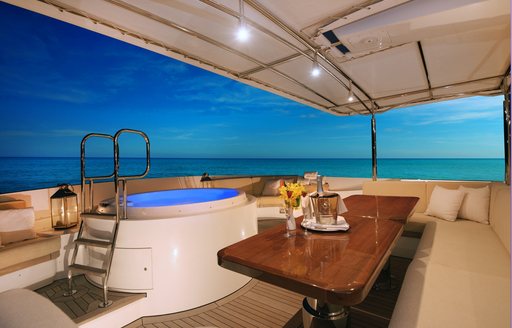 spa pool on the sundeck of charter yacht BELUGA with seating area nearby
