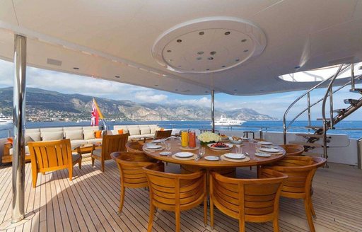 circular alfresco dining option on upper deck aft of luxury yacht HANIKON 