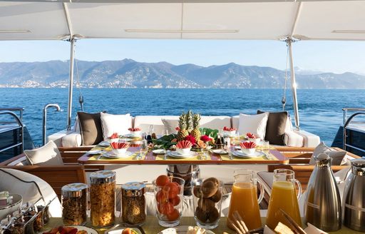 Aft deck dining on board charter yacht REVELRY