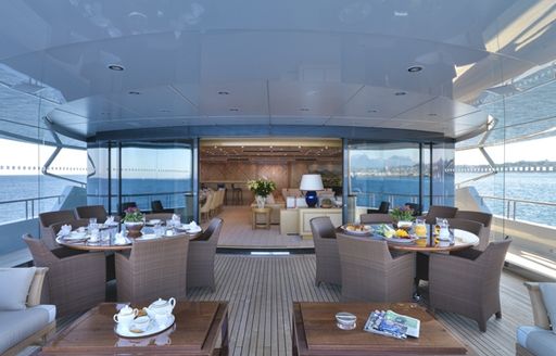 sun lounge with glass walls on board charter yacht natita