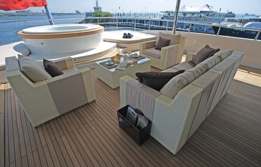 Seating arranged around a Jacuzzi on the upper deck of charter yacht TATIANA I