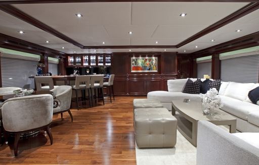 bar, games table and L-shaped sofa aboard luxury yacht COCKTAILS