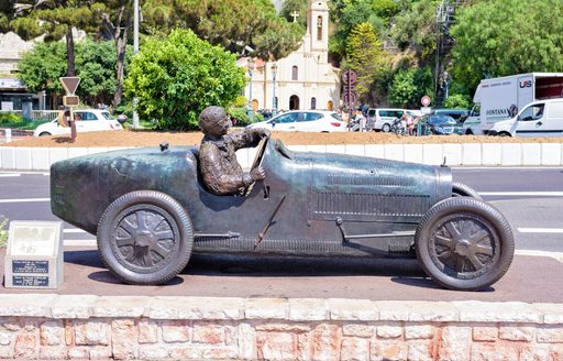 Famous statue of First Grand Prix Formula 1 racing car and William Grover as racer. 