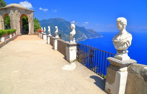 Open terrace and classical statues in the sun, Ravello, Amalfi coast, Italy