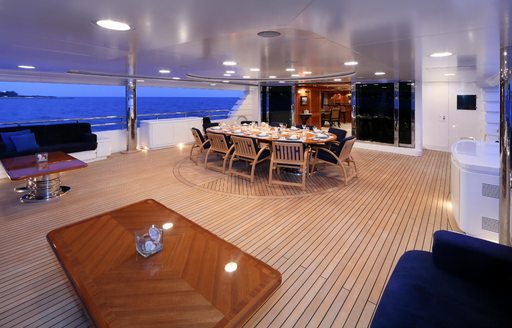 alfresco dining setup on the upper deck aft of luxury yacht ELENI 