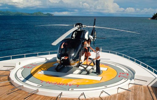Helipad and helicopter on board motor yacht Lauren L 