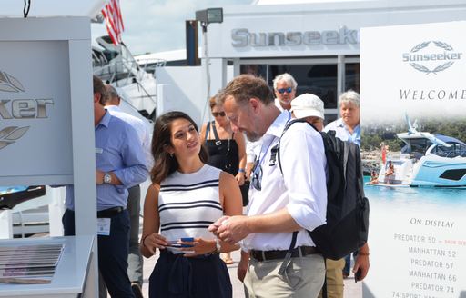 Man and woman speaking at Fort Lauderdale Boat Show