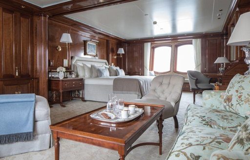 full-beam master suite with small lounge area on board superyacht KATHARINE 