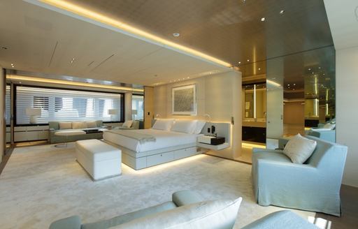 tranquil master suite with large bed and seating area on board luxury yacht NAUTILUS