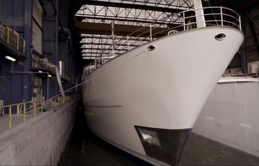 The freshly painted white hull of superyacht SHERAKHAN