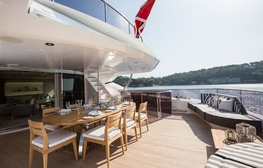 alfresco dining setup on upper deck aft of luxury yacht THUMPER 