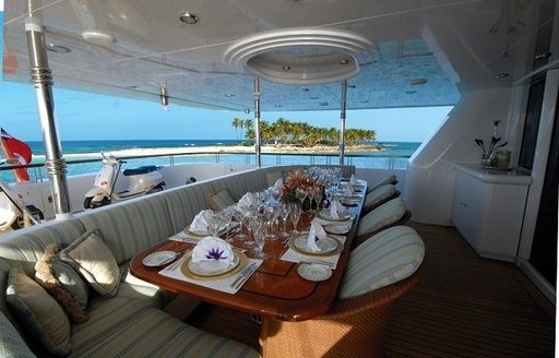 alfresco dining setup on the aft deck of charter yacht ALLEGRIA 