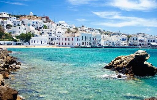 white buildings of Mykonos and glittering waters in Greece