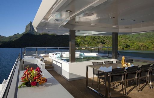 alfresco dining on sundeck of charter yacht ‘Big Fish’ 