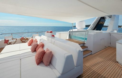 sun deck with BBQ and luxury Jacuzzi covered by Bimini on bright and sunny day in Antigua on motor yacht JOY 