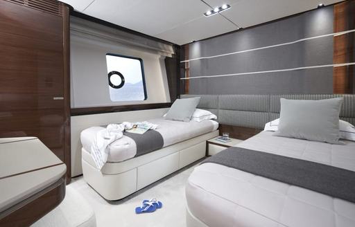 Overview of a twin cabin onboard charter yacht ANKA, two single berths separated by a nightstand