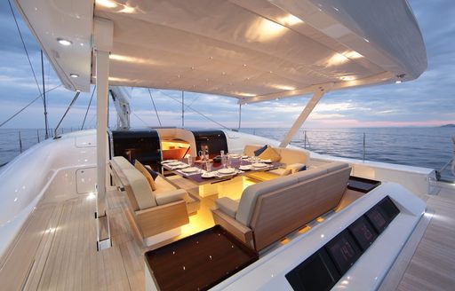 comfortable cockpit with alfresco dining on luxury yacht HEUREKA   