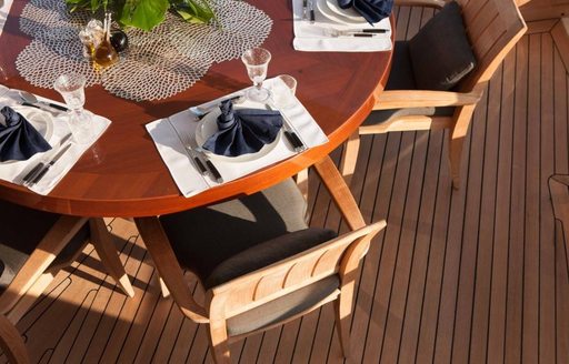 The alfresco dining table situated on the sundeck of luxury yacht Ice Lady