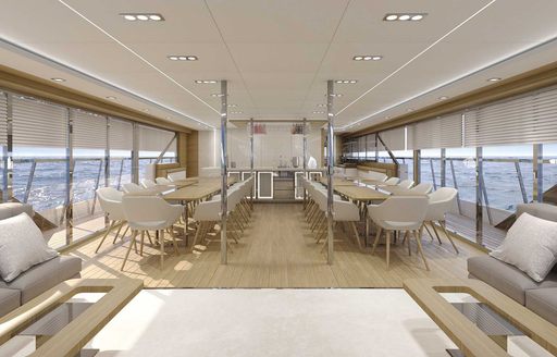 Spacious dining area onboard charter yacht ARGO with full length windows on both sides