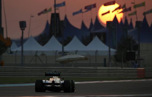 Formula one car racing at sunset in Dubai