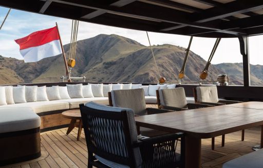 Exterior dining setup onboard charter yacht VELA