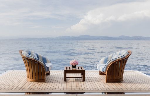 Overview of two armchairs on a fold down balcony onboard charter yacht CARINTHIA VII 
