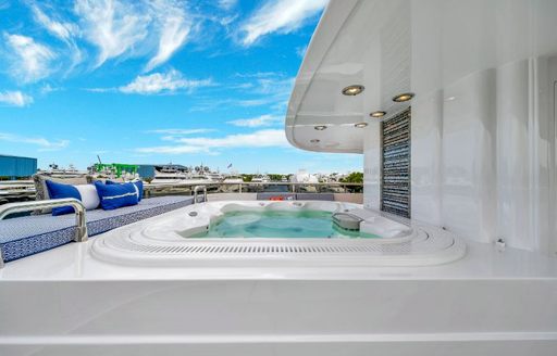 On-deck Jacuzzi with adjacent relaxation space onboard charter yacht VALHALLA