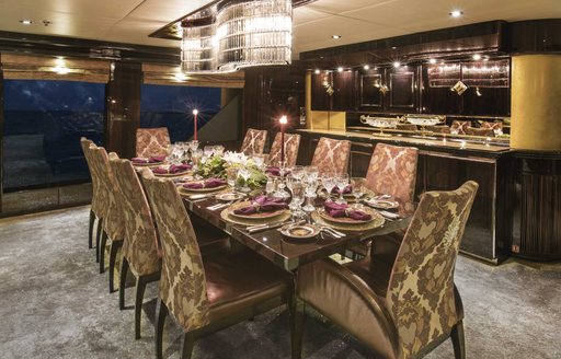 formal dining in main salon of charter yacht Lady Bee