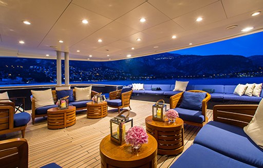 lounging areas at night on aft deck of luxury yacht MISCHIEF 