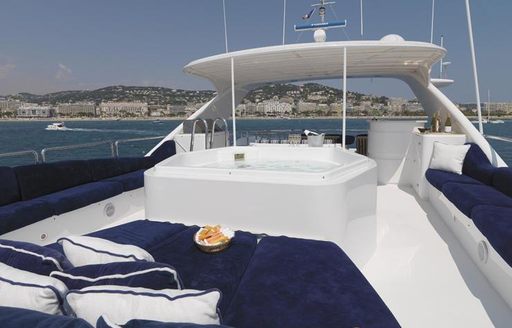 The Jacuzzi and surrounding sunpads on board luxury yacht ENCHANTRESS