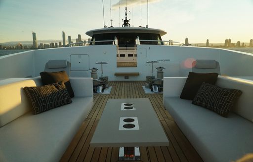 comfortable seating and table on foredeck of luxury yacht SAHANA 