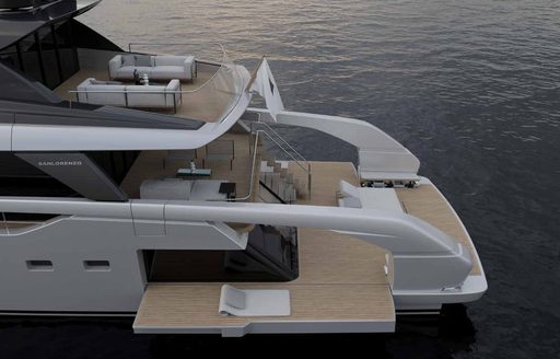 Elevated view of the fold down bulwark onboard Sanlorenzo SX100, sunlounger rests on top.