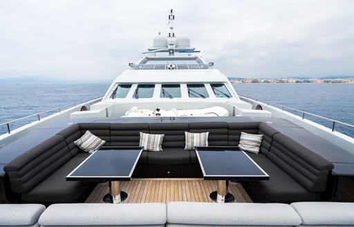 seating and tables on the foredeck of luxury yacht BLISS 