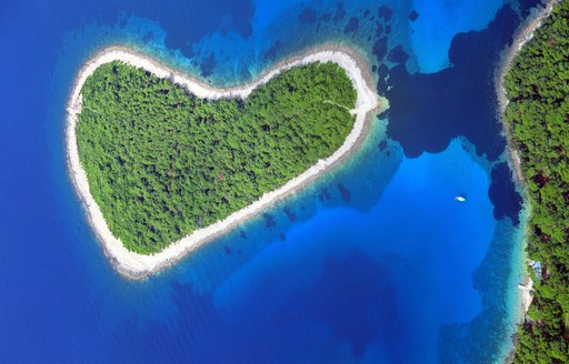 Aerial view over a lush heart-shaped island in Croatia