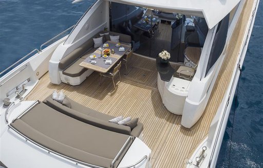 lounging, dining and bar on aft deck of motor yacht ‘Casino Royale’ 
