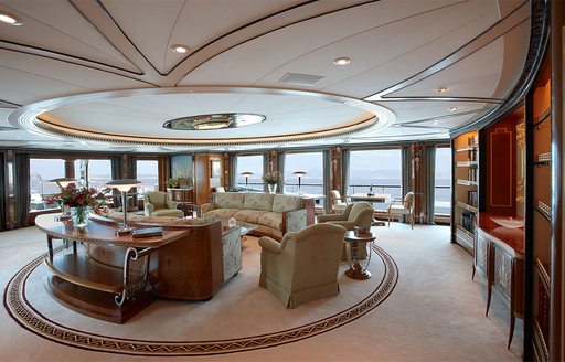 main salon lounge with floor-to-ceiling windows on board superyacht ‘Lady Christine’ 
