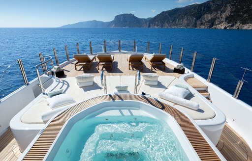 Deck Jacuzzi and sun loungers onboard charter yacht GALENE