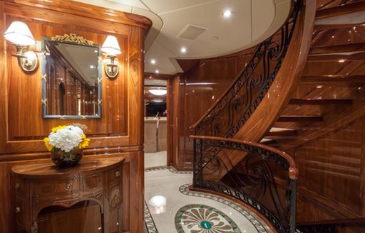 staircase and flowers on sidetable on board superyacht