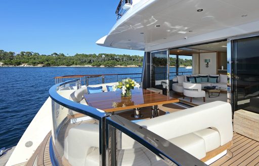 seating and table on aft deck of motor yacht SOLIS 