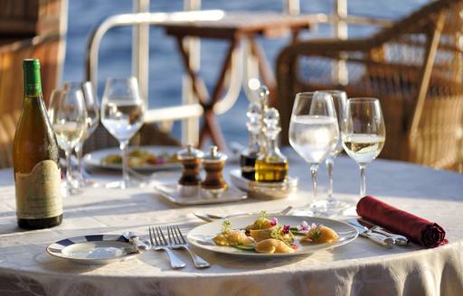 a beautifully prepared dining arrangement on a superyacht 
