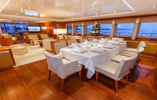 dining salon of superyacht agram, with main salon in background