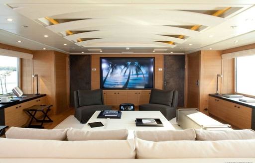 large TV screen and sofa in skylounge of luxury yacht SPIRIT 