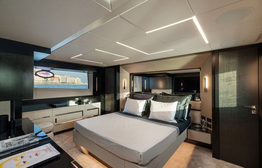 Overview of the master cabin onboard charter yacht SOPHIA, central berth with a window to port side