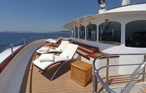Sun loungers lined up on deck of expedition yacht Sherakhan 