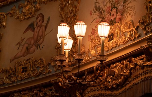 Beautiful sconces adorn the walls of La Teatro Fenice in Venice, Italy