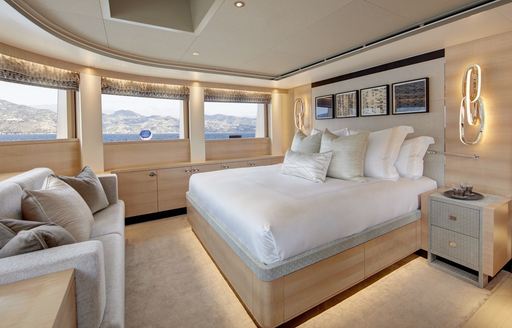Master cabin onboard charter yacht LADY VICTORIA, central berth facing forward with surrounding glazing