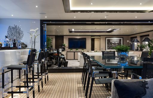 Aft dining area and bar on board charter yacht TRIUMPH