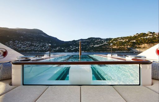 The swimming pool located on the sundeck of luxury yacht SYMPHONY