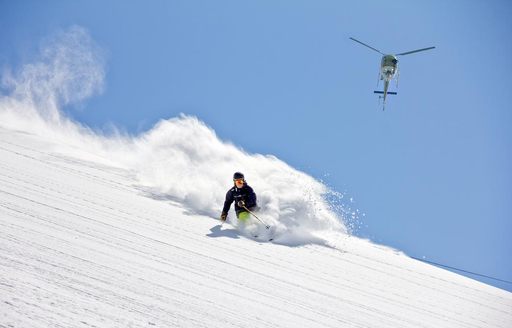 Heli-skiing on an explorer yacht charter onboard MY La Datcha