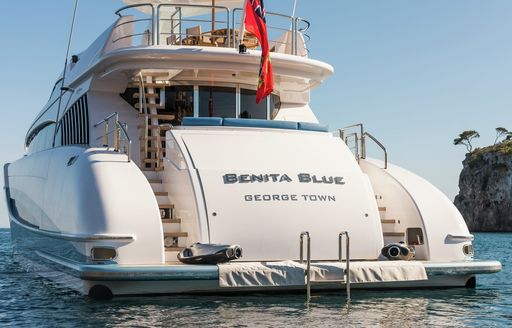 aft view of motor yacht Benita Blue when anchored in Ibiza on a luxury yacht charter